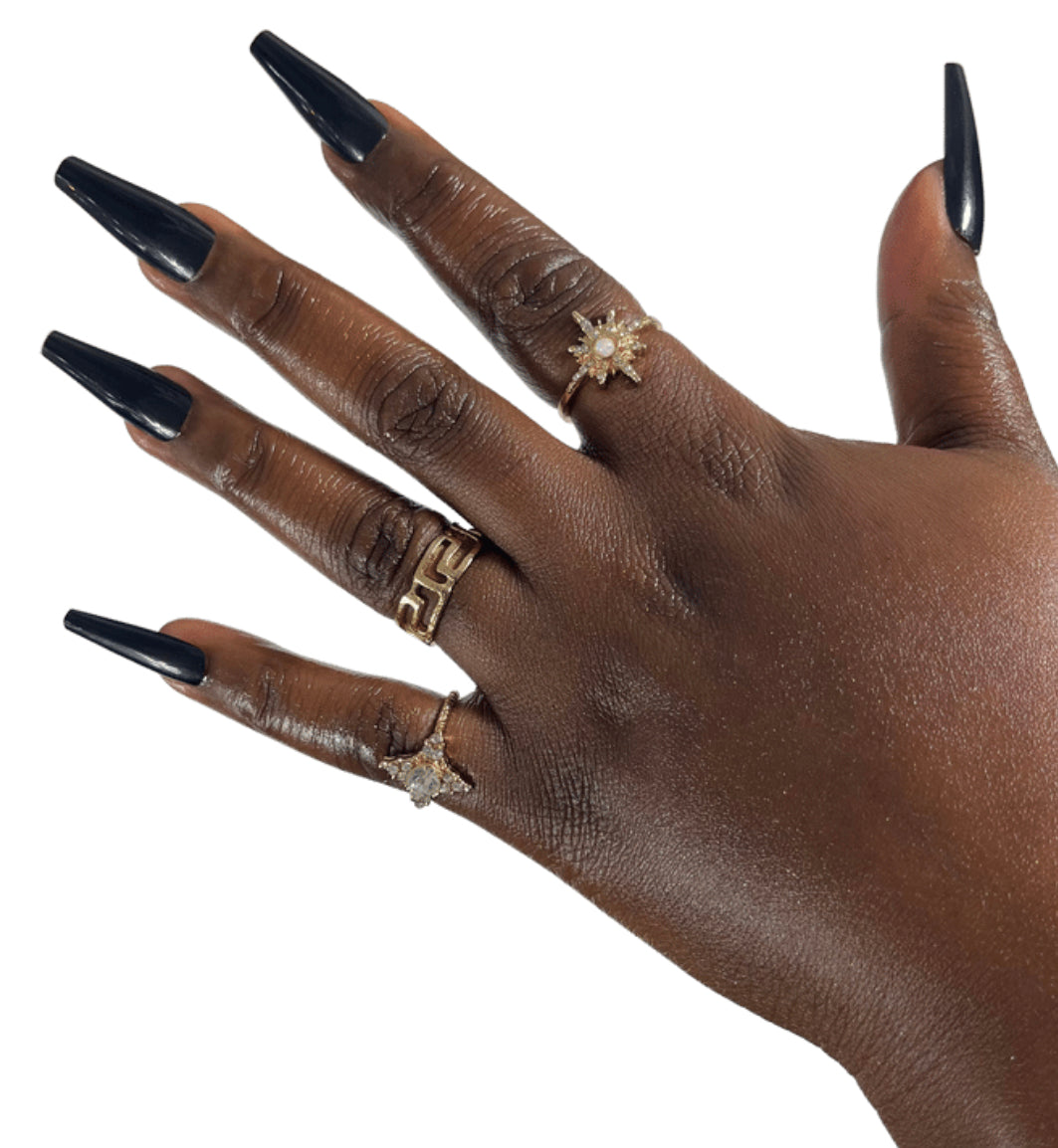 Model Wearing Casket Ready Beauty's Coffin-shaped long length glossy dark solid black nails. 